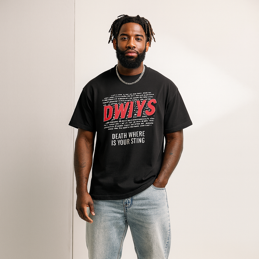 Person wearing a black t-shirt with red and white text, standing against a plain background